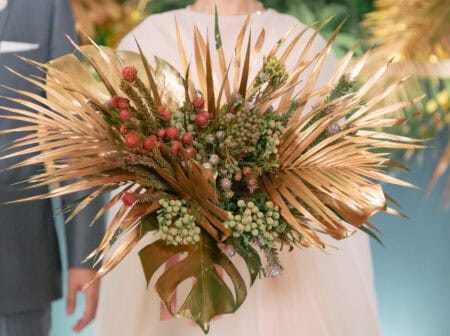 Bridal Bouquet Decorated with Gold Monstera Leaves and Pine Flowers